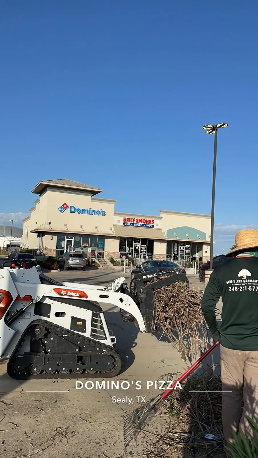 Landscape clearing and bed preparation at a retail property