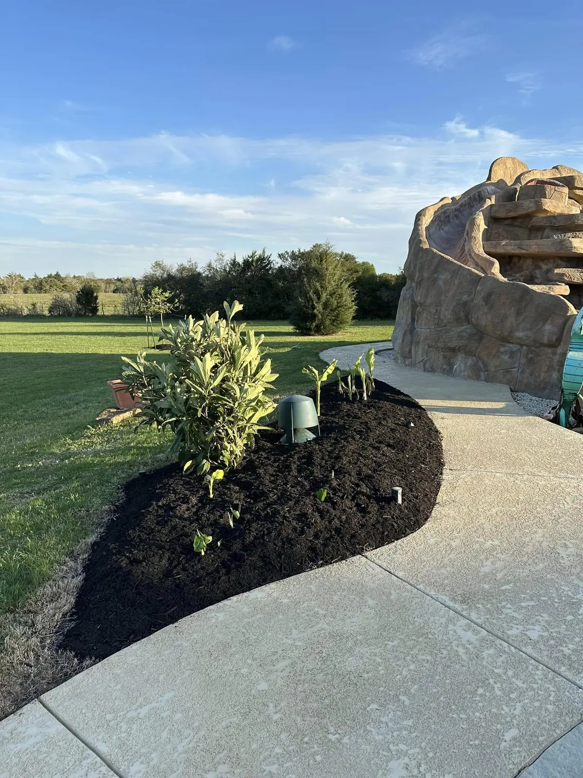 Completed poolside planting and mulch bed
