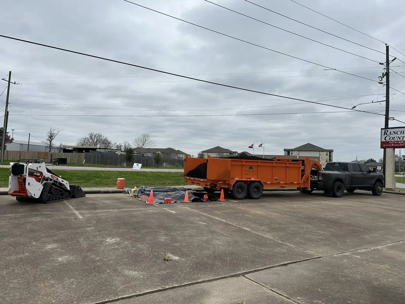 Mulch delivery staged in a commercial parking area