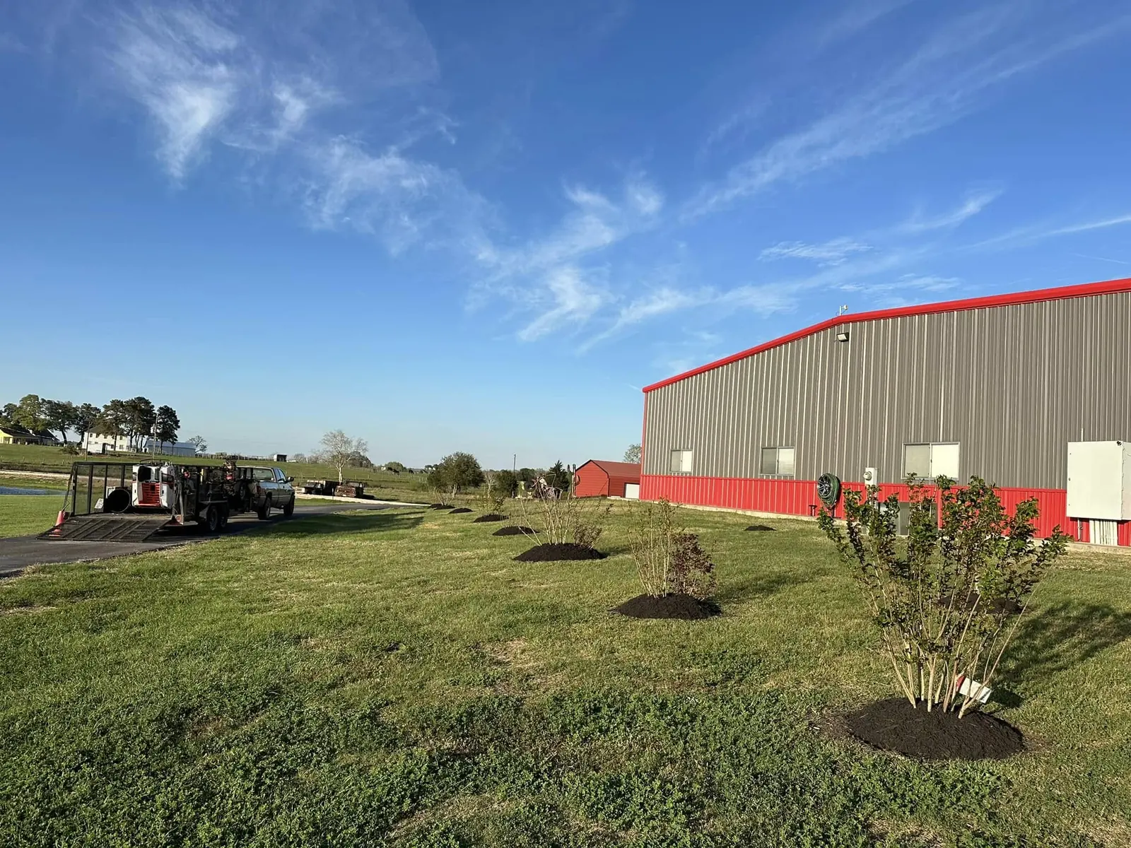Completed shrub and mulch installation at a commercial building