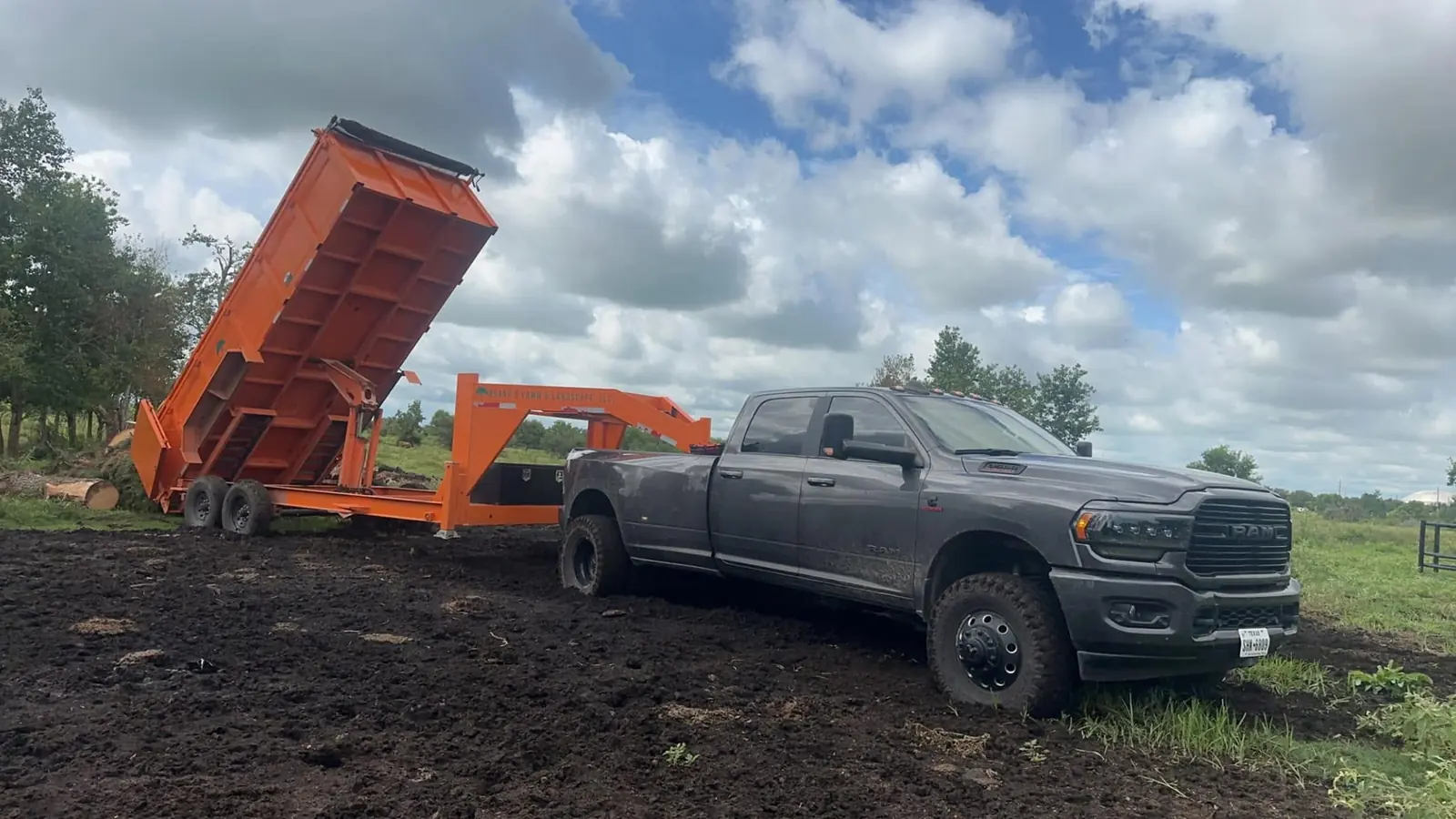Brand S truck and dump trailer at an active outdoor cleanup project