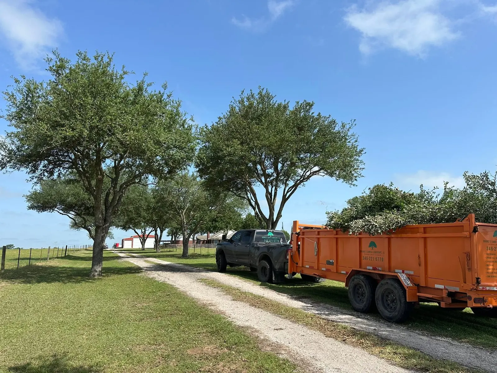 Brand S truck and loaded debris trailer after tree work