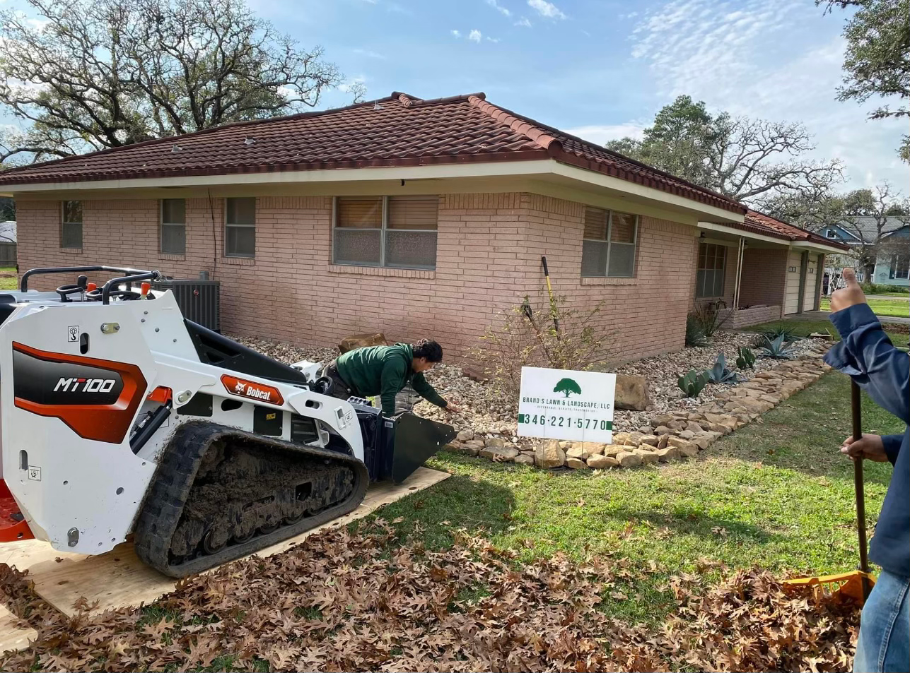 Brand S skid-steer working on a landscape renovation