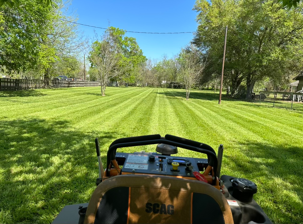 Large freshly mowed property with equipment in view